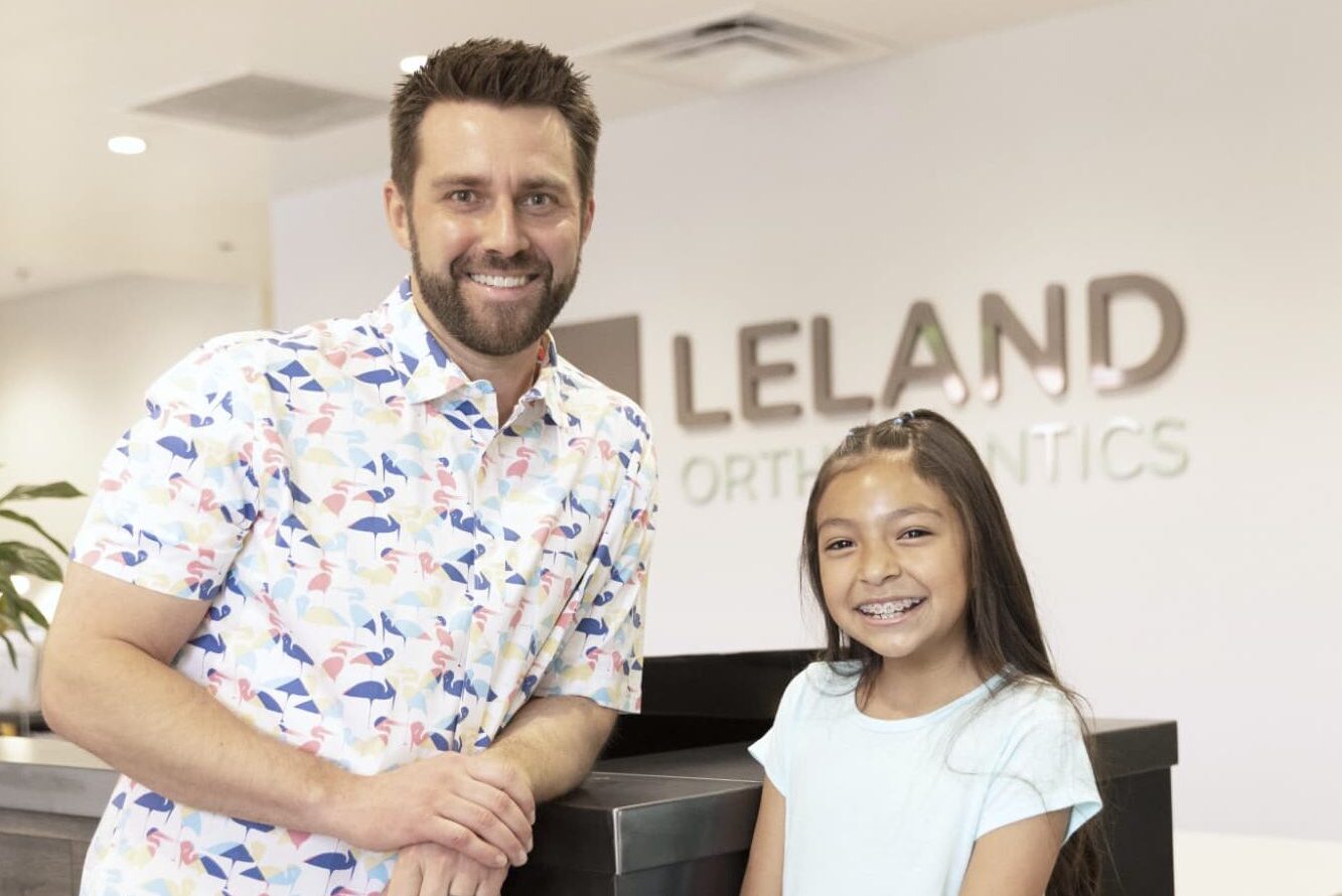 Dr. Andrew J. Leland and happy kids
