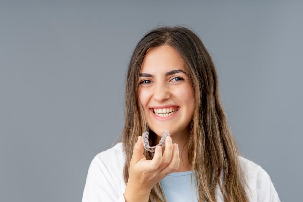 cute girl showing his braces